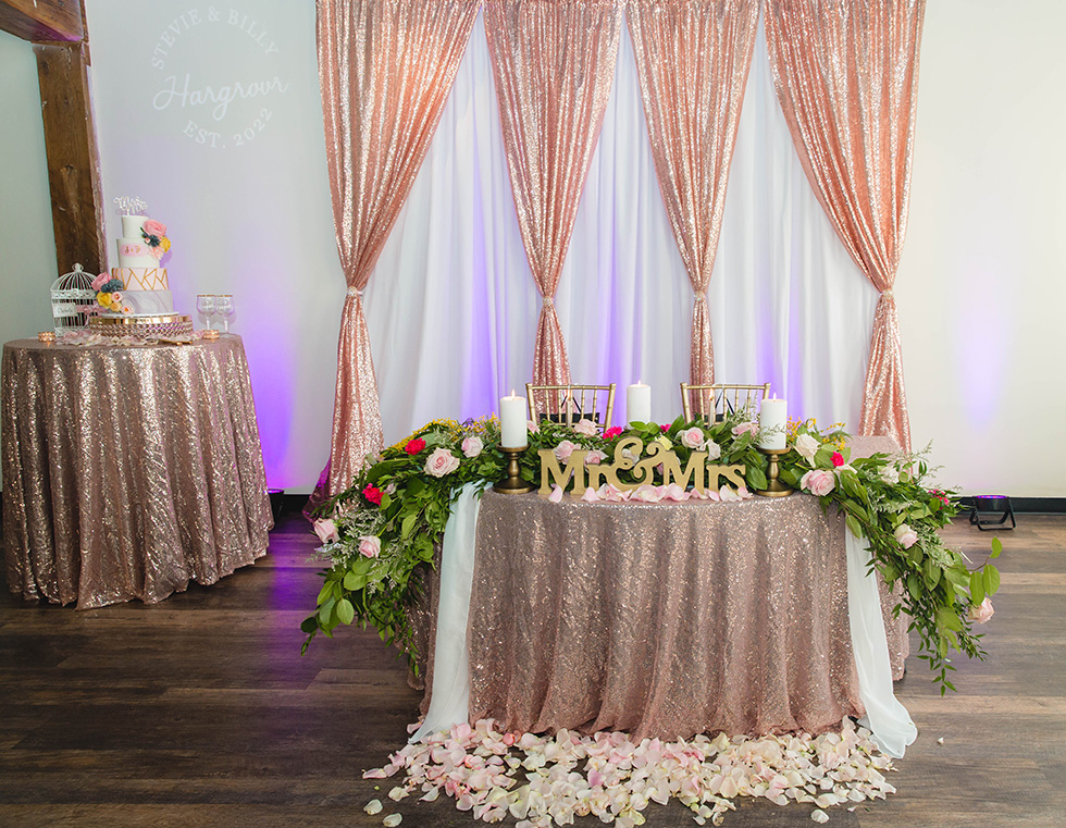 Backdrop for sweetheart table at wedding