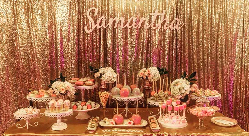 Gold sequin backdrop with sweets table