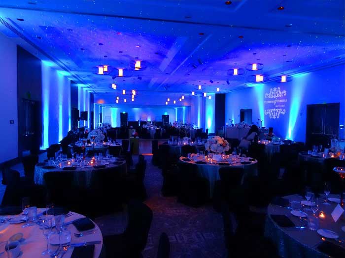 Blue Uplighting for a Wedding Reception | Rent online for $19/each + free shipping both ways nationwide at www.RentMyWedding.com/Rent-Uplighting