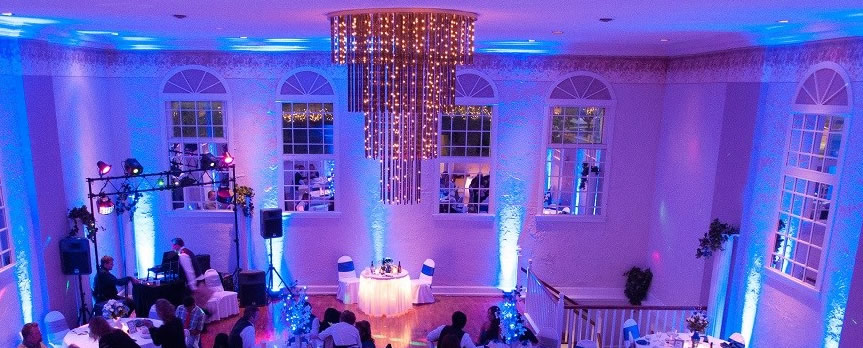 Blue uplighting with tall ceilings | Rent online for $19/each + free shipping both ways nationwide at www.RentMyWedding.com/Rent-Uplighting